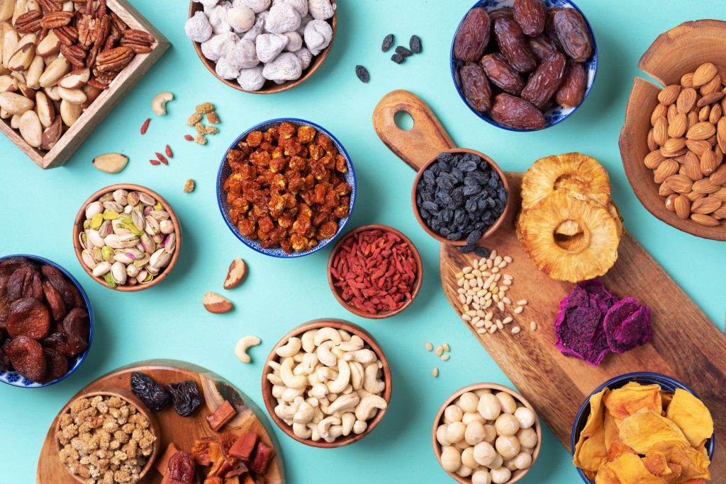 Assortment of nuts and dried fruits - brazil nuts, cashew, pecan, almonds, macadamia, pine nuts